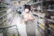 A woman wearing a face mask in a grocery store.